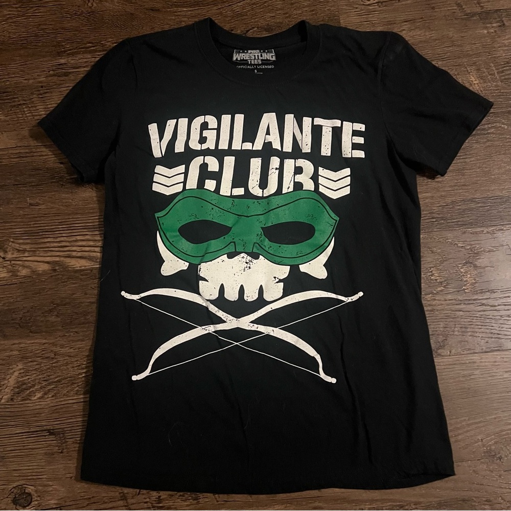 Pro wrestling tees Vigilante Club Graphic Tee Black with green & white Print